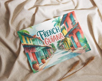 May include: Watercolor illustration of a street scene in French Guiana. The artwork features colorful buildings with red, yellow, and turquoise facades, with the text "French Guiana" in teal and coral.