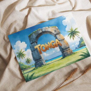 May include: Watercolor print depicting a stone archway with the word "TONGA" in orange. The scene shows a tropical beach with palm trees, blue sky, and white clouds. The print is on a beige fabric surface.