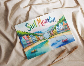 May include: Watercolor print of Sint Maarten with colorful buildings, boats, and the text "Sint Maarten" in rainbow colors. The artwork depicts a coastal town with a bay and sailboats, set against a backdrop of green hills. The print is on a cream-colored fabric.