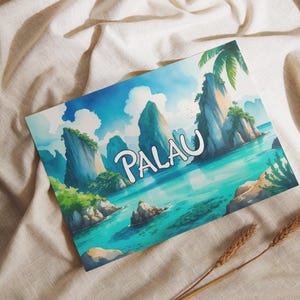 May include: A watercolour print depicting a tropical island scene with the word "PALAU" in white script. The artwork shows turquoise waters, green islands, and a bright blue sky with fluffy clouds. Two stalks of wheat are in the foreground.