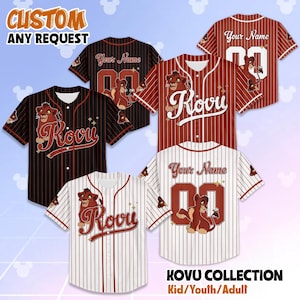 May include: Baseball jerseys in various colors, including black, red, and white, with vertical stripes. Each jersey features the name "Kovu" or "Your Name" and a number. The jerseys have a cartoon lion graphic. Text on the image reads "CUSTOM ANY REQUEST" and "KOVU COLLECTION Kid/Youth/Adult".