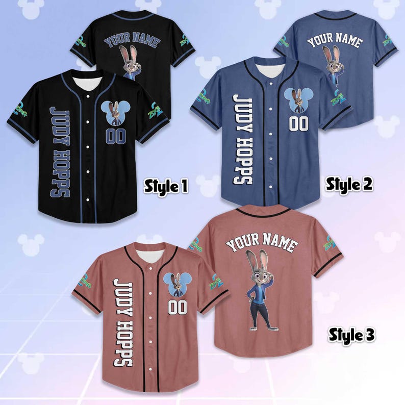 May include: Baseball jerseys in black, blue, and reddish-brown, each featuring a cartoon rabbit character. The jerseys display "JUDY HOPPS" and "YOUR NAME" with the number "00". The design includes a cartoon character and a Mickey Mouse-shaped logo.