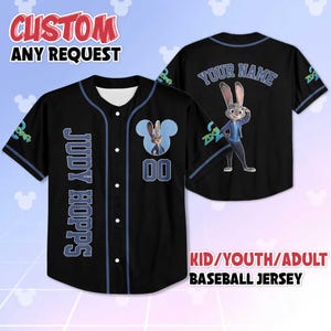 May include: Black baseball jersey with blue accents, featuring "JUDY HOPPS" on the front and a cartoon rabbit graphic. The jersey includes the text "CUSTOM ANY REQUEST" and "KID/YOUTH/ADULT BASEBALL JERSEY".