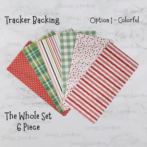 May include: A set of six patterned paper sheets for tracker backing. The papers feature a variety of red, green, and white patterns, including plaid, stripes, polka dots, and gingham. The text "Tracker Backing Option 1 - Colorful" and "The Whole Set 6 Piece" is visible on the image.