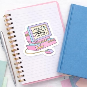 May include: A die-cut sticker featuring a retro-style desktop computer in pastel pink and purple. The screen displays the text 'None of your emails are finding me well' surrounded by small heart icons. A matching computer mouse is connected by a cord.
