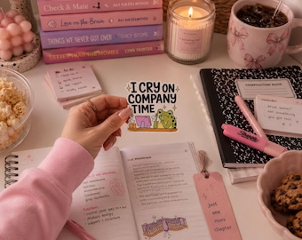 May include: A die-cut vinyl sticker featuring a green frog sitting at a computer desk, holding a tissue to its face, with the text "I CRY ON COMPANY TIME" in bold black letters, accented by small yellow stars on a white background.