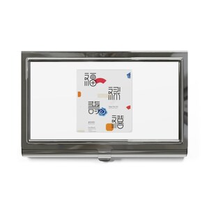 May include: A silver metal business card holder with a white background and a colorful graphic design featuring Chinese characters and a blue flower. The graphic design includes the text "Happy New Year".
