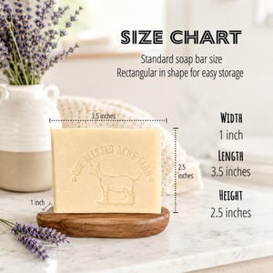 May include: A rectangular beige soap bar featuring an embossed goat and the text One Blessed Acre Farm. The soap measures 8.89 cm in length, 6.35 cm in height, and 2.54 cm in width, as indicated by the visible size chart and measurements.