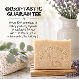 May include: A rectangular bar of beige soap with a textured surface, featuring an embossed goat graphic and the text "ONE BLESSED ACRE FARM". Above, text reads "GOAT-TASTIC GUARANTEE" followed by a commitment statement regarding customer satisfaction.