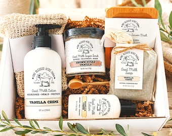 May include: A gift box containing One Blessed Acre Farm products: an 8 fl. oz. bottle of Vanilla Creme goat milk lotion, a 6 oz. jar of brown sugar vanilla goat milk sugar scrub with a wooden spoon, a 4.5 oz. bar of vanilla creme goat milk soap, and a bamboo soap dish.