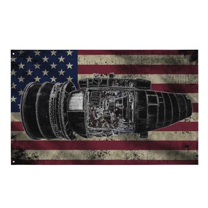May include: A distressed American flag design featuring a detailed illustration of a jet engine. The engine is depicted in black and white, showcasing its internal components. The background is the red, white, and blue of the American flag.