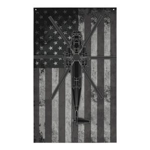 May include: A black and white distressed American flag with a silhouette of a helicopter in the centre.
