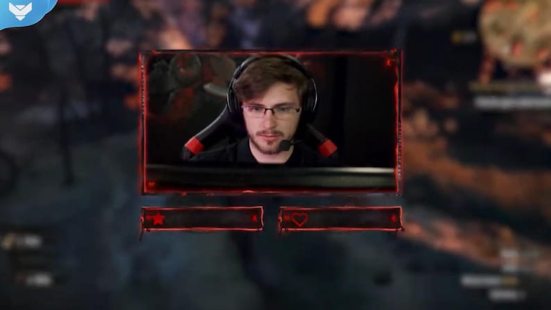 May include: A live streaming overlay featuring a person wearing a headset and glasses. The overlay has a red border and two red boxes with icons. The background is blurred.