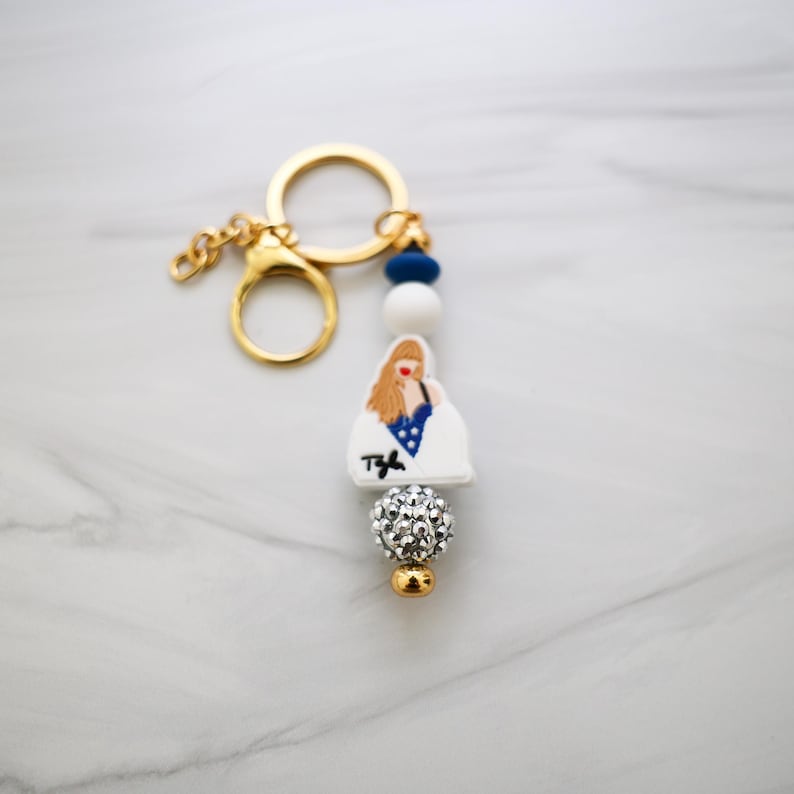 a keychain with a picture of a woman on it