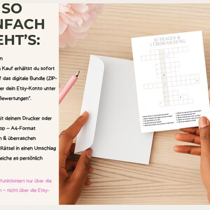 May include: A white envelope and a crossword puzzle are held on a wooden surface. The crossword puzzle is titled "10 Questions & 1 Surprise." Text in German explains how to download, print, and give the puzzle. A pink pen is also visible.