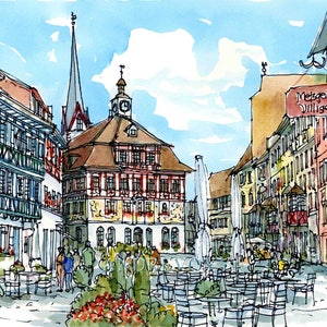 May include: A watercolour painting of a European town square with a tall church spire in the background. The square is lined with buildings with colourful facades and there are tables and chairs set up for outdoor dining. The sign on the building reads "Metzger Villger".