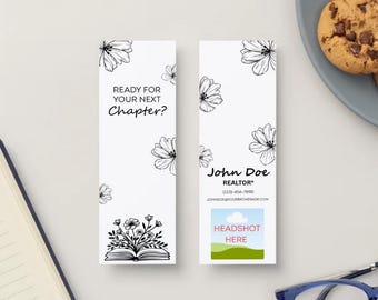 May include: Two white bookmarks with black floral designs and the text "READY FOR YOUR NEXT CHAPTER?". One bookmark features an open book with flowers. The other has a realtor's contact information and a space for a headshot.