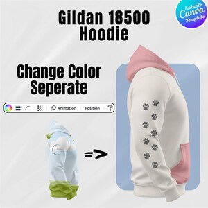 May include: A white Gildan 18500 hoodie with a pink hood and pocket. The sleeve features a pattern of gray paw prints. The image includes the text "Change Color Separate" and a Canva template logo.