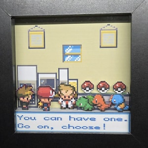 May include: Framed pixel art scene featuring characters and creatures from a video game. The artwork includes a selection of creatures, three Poké Balls, and text that reads "You can have one. Go on, choose!"