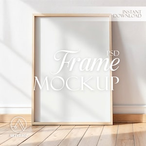 May include: A rectangular wooden frame mockup with the text "Frame MOCKUP" in a white, elegant font. The frame is leaning against a white wall, with a wooden floor in the foreground. The words "INSTANT DOWNLOAD" are in the upper right corner.
