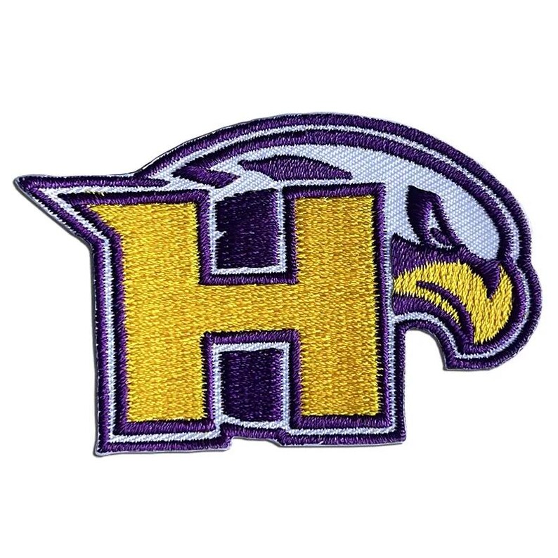 May include: Purple and gold embroidered patch featuring a stylised letter "H" and a bird design.