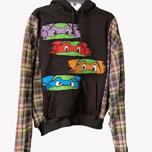 May include: A set of three ceramic mugs with a speckled, matte finish. The mugs are in shades of cream, light gray, and dark gray. Each mug has a simple, minimalist design, perfect for coffee or tea.