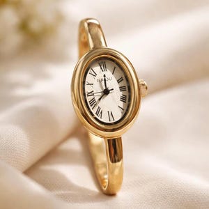 Minimalist Oval Bangle Watch, Gold Tone Roman Numeral Bracelet image 2
