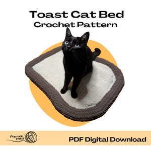 May include: A black cat with blue eyes sits on a crocheted cat bed. The bed is white with a brown border. Text at the top reads "Toast Cat Bed Crochet Pattern". The bottom text says "PDF Digital Download".