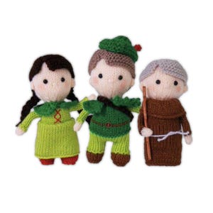 May include: Three handmade knitted dolls. The dolls are dressed in green, brown, and gray outfits. The doll on the left has black braids and a green dress. The middle doll wears a green outfit and hat. The doll on the right has gray hair and a brown robe.