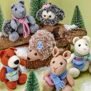 May include: A collection of knitted animal toys, including a grey squirrel, a brown hedgehog, a brown owl, a brown rabbit, and a white rabbit. The toys are all wearing scarves and are sitting on a wooden log.