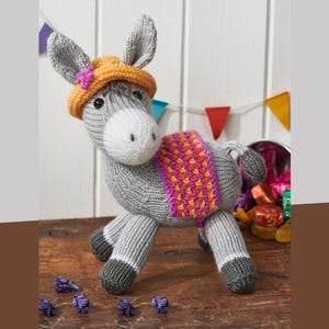 May include: A white ceramic mug with a black handle and the text "But First, Coffee" in a bold, black font. The mug is set against a neutral background, highlighting its simple design.