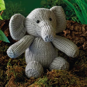 May include: A white ceramic mug with a black handle and the text "But First, Coffee" in a black, bold font. The mug is on a white surface.