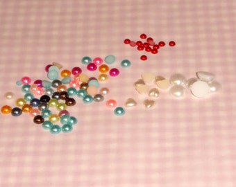 Over 100 flat back acrylics ... pearls, hearts, stars, and circles ....  in varying sizes, in different colors ...  You will get a MIX