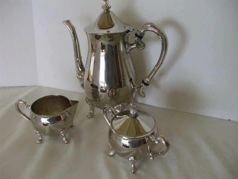 F B Rogers Silver Plate Coffe Pot, Creamer, Sugar Bowl Footed Match Set