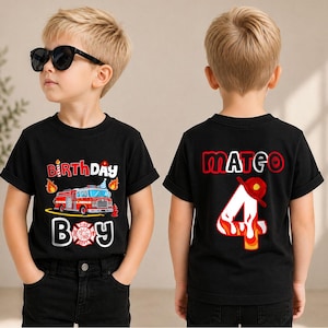May include: A black short-sleeved t-shirt featuring a fire truck graphic with the text "BIRTHDAY BOY" on the front and the name "MATEO" above a large number "4" with a fire-themed design and a red firefighter helmet on the back.