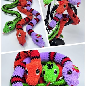 Peut inclure: Jouets en forme de serpents crochet&eacute;s, de couleurs verte, orange, rouge et violette. Les serpents ont des yeux noirs et blancs et des langues rouges. Les jouets sont pr&eacute;sent&eacute;s dans diff&eacute;rentes poses.