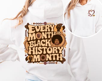 May include: White hoodie with a brown and black graphic print on the back that says "Every Month is Black History Month". The graphic includes a stylized black woman's face and a raised fist.