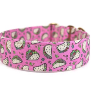 May include: Pink dog collar with a pattern of white tacos on a pink background.