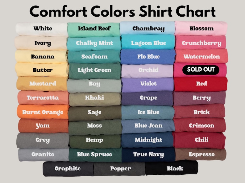 May include: A Comfort Colors shirt colour chart, showing folded t-shirts in a range of hues. The chart includes colours such as white, island reef, chambray, and blossom. The text "Comfort Colors Shirt Chart" is at the top.
