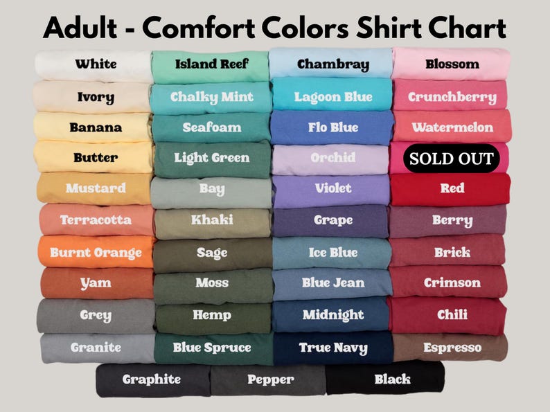 May include: A colour chart for Comfort Colors shirts featuring a grid of folded fabric swatches in various shades including white, ivory, yellow, orange, red, pink, purple, blue, green, grey, brown, and black, with text labels for each colour.