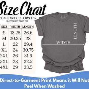May include: A charcoal gray short-sleeve t-shirt displayed with a size chart for Comfort Colors 1717. The chart lists sizes S through 4XL with width and length measurements in inches. Text at the bottom states: Direct-to-Garment Print Means it Will Not Peel When Washed.