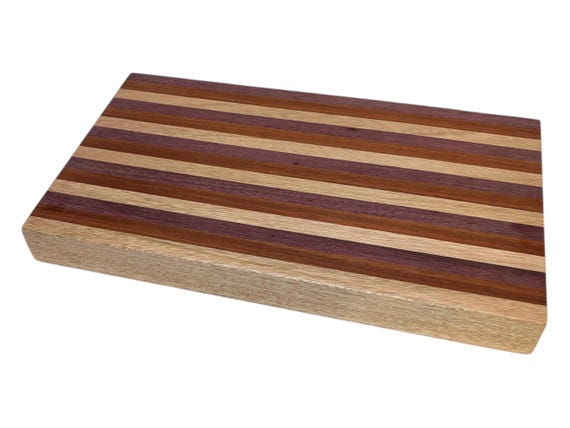 The trio of Purpleheart, African mahogany, and bloodwood creates a striking natural color palette that looks almost too vivid to be real.