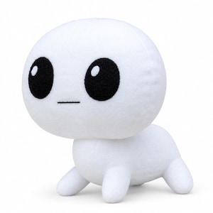 Può includere: Un peluche bianco caratterizzato da una grande testa arrotondata con due occhi circolari neri sovradimensionati e una piccola linea orizzontale nera come bocca. La creatura ha un corpo compatto a quattro zampe corte e tozze.