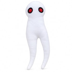 Puede incluir: Un peluche blanco con una cabeza redondeada y dos largos apéndices en forma de piernas. El juguete presenta dos ojos circulares con centros de color rojo brillante rodeados por gruesos bordes negros bordados, creando un contraste con el cuerpo de tela blanca.