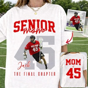 May include: White t-shirt with red text that reads "SENIOR mom 45 Jack THE FINAL CHAPTER." The shirt features a photo of a lacrosse player in a red jersey with the number 45. A smaller image on the shirt shows the back of the shirt with "MOM of 45."