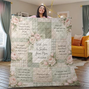May include: A personalised quilt with a floral and plaid design. The quilt features pastel pink and green squares with inspirational quotes and the text "With Love to Sophia from Mom 05.12.2026."