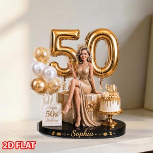 May include: A cake topper featuring a figurine of a person in a gold dress sitting on a gift box, flanked by gold number 50 balloons, a small white cake with gold drip, and a sign reading Happy 50th Birthday. The base is black with the name Sophia.