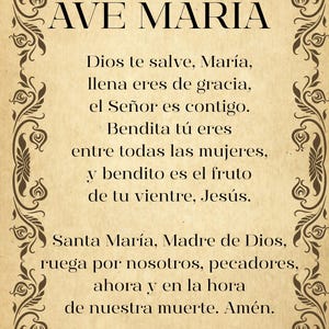 May include: A vintage-style print featuring the words "AVE MARIA" at the top, framed by a dark brown, ornate border. The prayer is written in Spanish on a beige background.