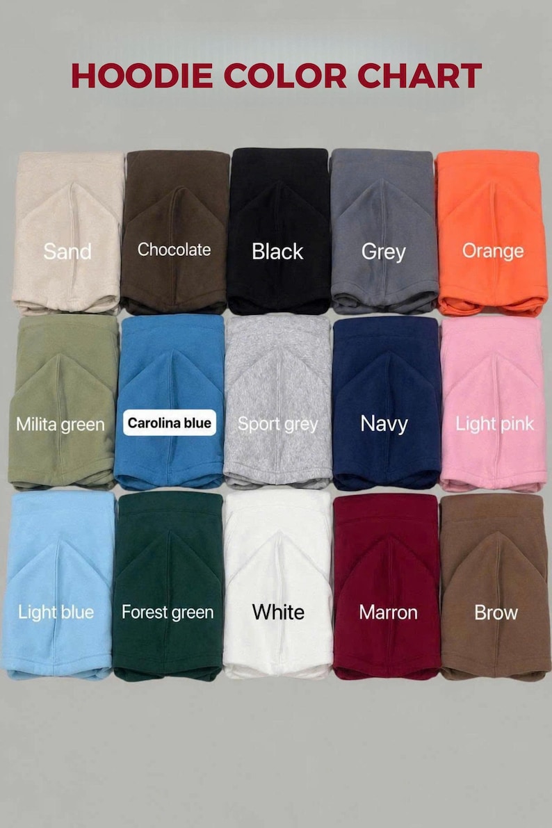 May include: A hoodie color chart featuring fifteen folded hoodies in various colors arranged in a grid. The text HOODIE COLOR CHART appears at the top. Colors include sand, chocolate, black, grey, orange, military green, Carolina blue, sport grey, navy, light pink, light blue, forest green, white, maroon, and brown.