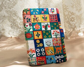 May include: A colorful wallet with a patchwork design featuring floral and geometric patterns in various colors. The wallet has the name "Giselle" printed on it. The brand name "ingpiggy bankbamboo" is also visible.
